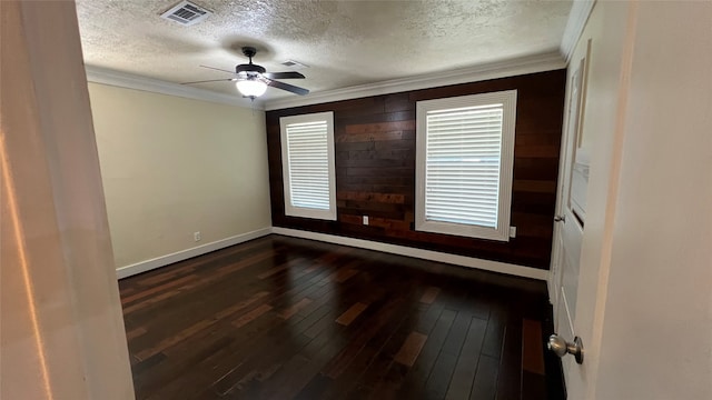 unfurnished room featuring crown molding, a textured ceiling, ceiling fan, and dark hardwood / wood-style flooring