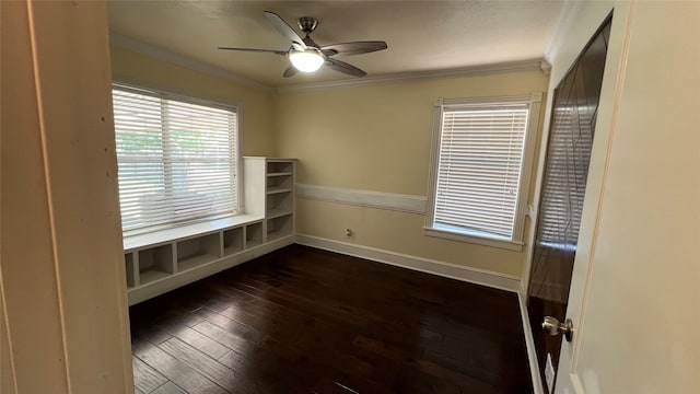 unfurnished room with dark hardwood / wood-style flooring, ceiling fan, and crown molding