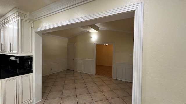 tiled spare room with lofted ceiling with beams