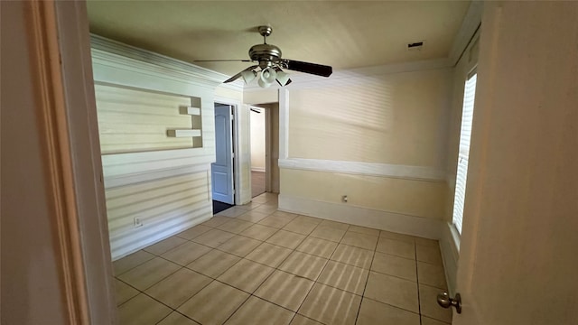 unfurnished room featuring ceiling fan and light tile floors