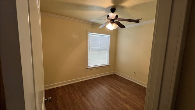 spare room with ceiling fan, dark hardwood / wood-style floors, and crown molding