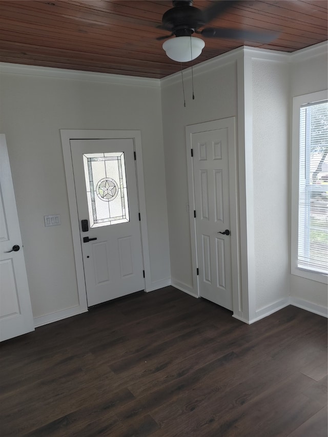 entrance foyer featuring a healthy amount of sunlight, dark wood-type flooring, and wooden ceiling