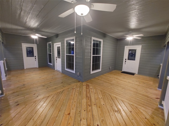 interior space with ceiling fan