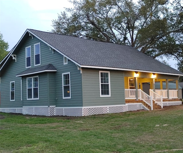 view of front of home featuring a porch and a front lawn