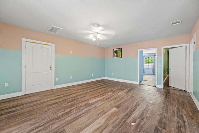 unfurnished room with hardwood / wood-style flooring and ceiling fan