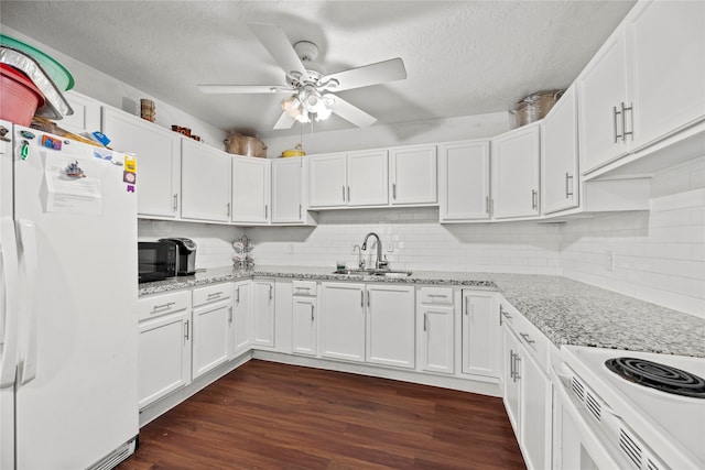 kitchen with backsplash, ceiling fan, white fridge with ice dispenser, white cabinetry, and dark hardwood / wood-style flooring