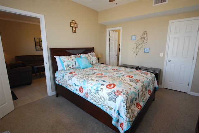 bedroom with dark colored carpet and ceiling fan