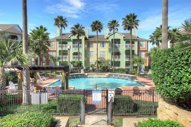 view of swimming pool featuring pool water feature