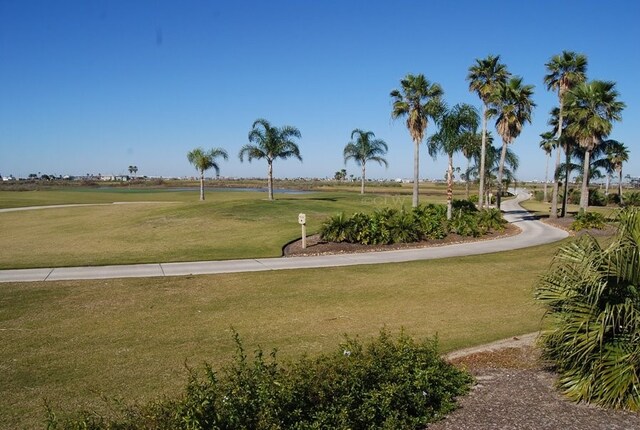 view of home's community with a yard