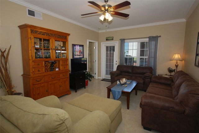 living room with ornamental molding, ceiling fan, and light tile flooring