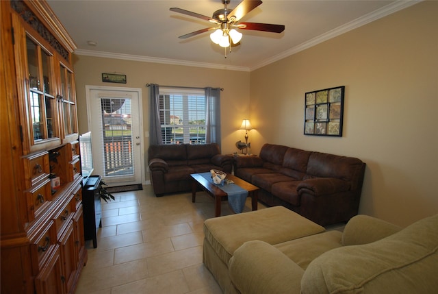 living room with ceiling fan, crown molding, and light tile flooring