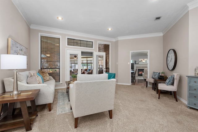 carpeted living room featuring french doors and crown molding