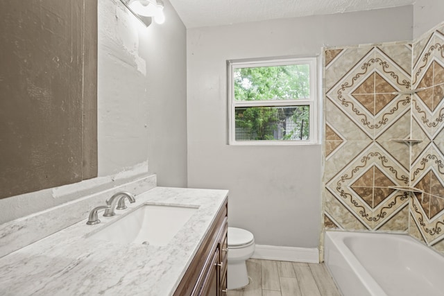 bathroom featuring a textured ceiling, large vanity, hardwood / wood-style flooring, and toilet