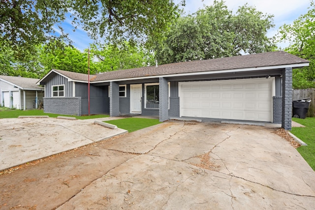 ranch-style home featuring a garage