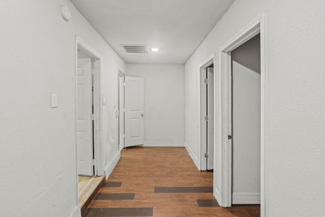 hall featuring dark wood-type flooring