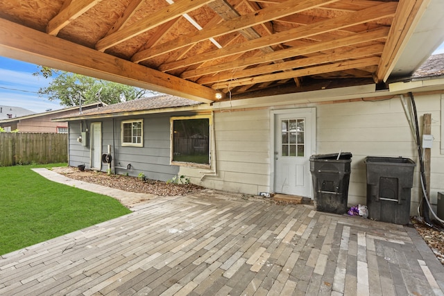 deck featuring a patio and a yard