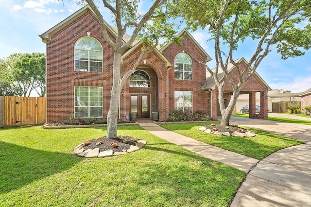 front facade with a front lawn and a garage