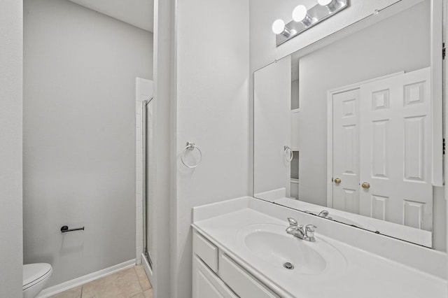 bathroom featuring a shower with door, toilet, tile flooring, and vanity