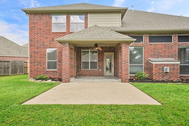 exterior space featuring ceiling fan, a front lawn, and a patio