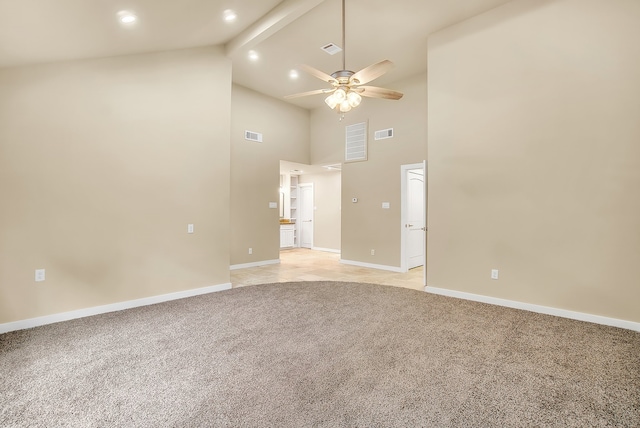 carpeted empty room with beamed ceiling, high vaulted ceiling, and ceiling fan