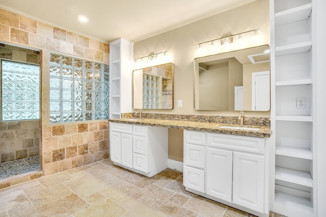 bathroom featuring double vanity and tile flooring