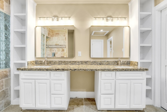 bathroom with tile flooring and double sink vanity