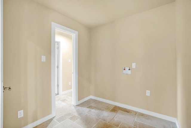 unfurnished room with light tile flooring