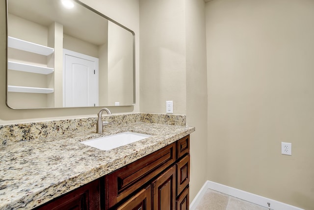 bathroom featuring tile flooring and vanity