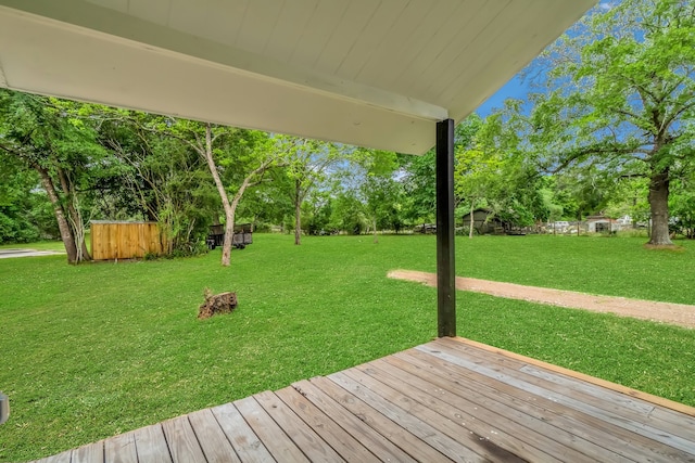 wooden terrace with a yard