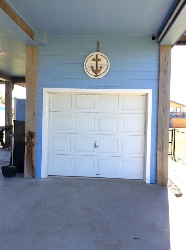 garage featuring wooden walls