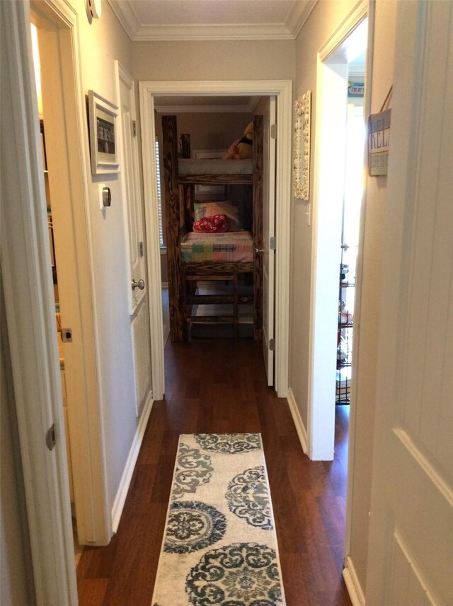 hall featuring ornamental molding and dark hardwood / wood-style floors