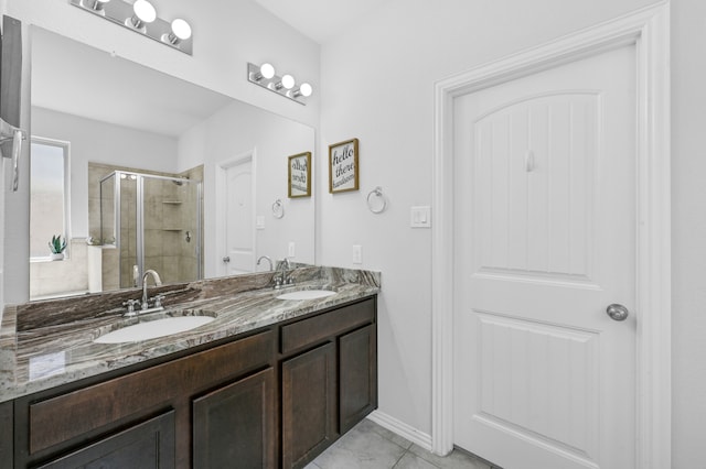 bathroom featuring tile flooring, dual sinks, an enclosed shower, and large vanity