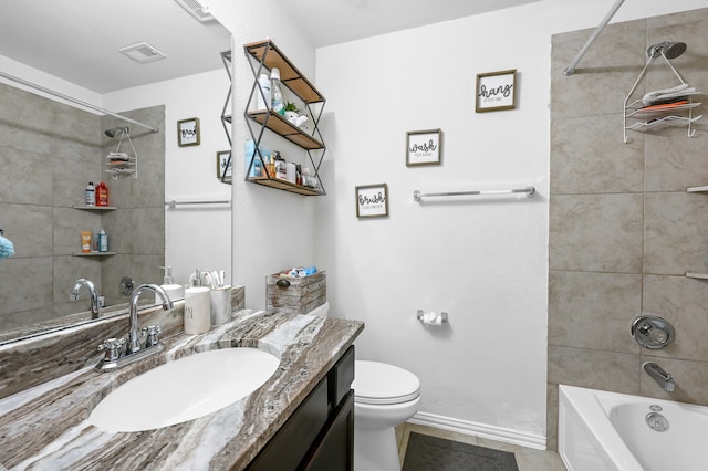 full bathroom with tiled shower / bath combo, toilet, tile flooring, and vanity