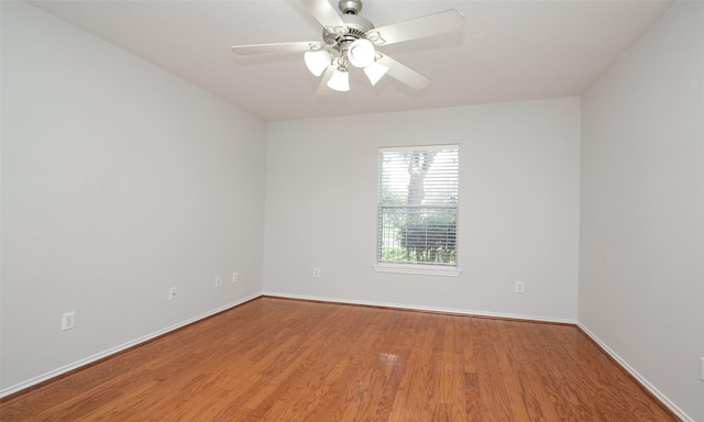 unfurnished room featuring hardwood / wood-style flooring and ceiling fan