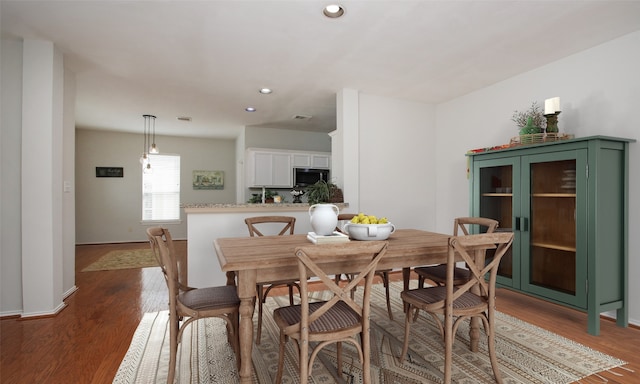 dining room featuring dark wood-type flooring