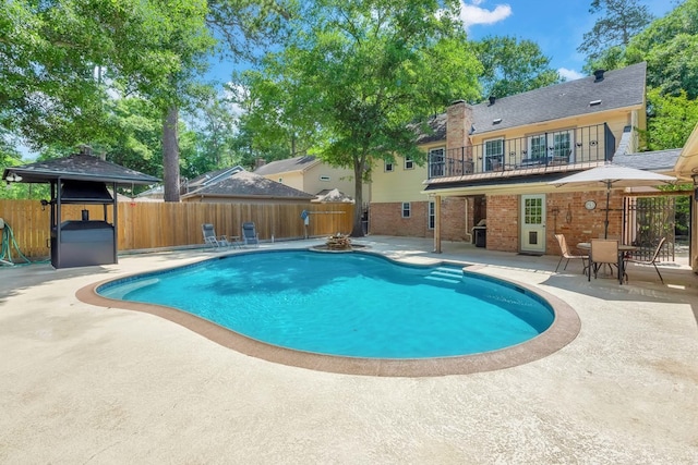 view of pool featuring a patio area