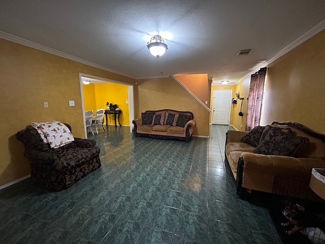 interior space featuring ornamental molding, dark tile floors, and a textured ceiling