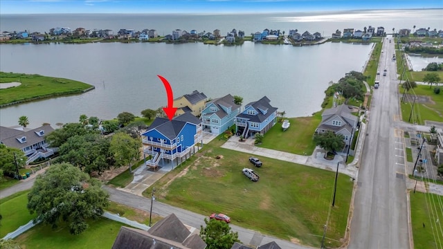 birds eye view of property featuring a water view