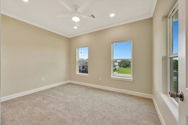 carpeted spare room with ornamental molding and ceiling fan