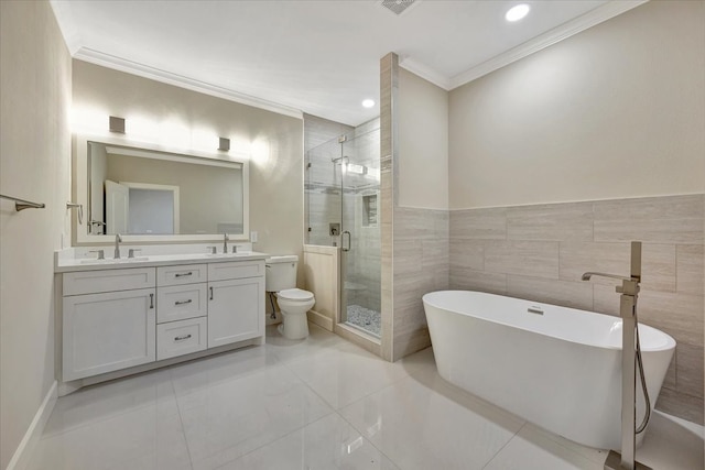 full bathroom with tile walls, vanity, crown molding, separate shower and tub, and toilet