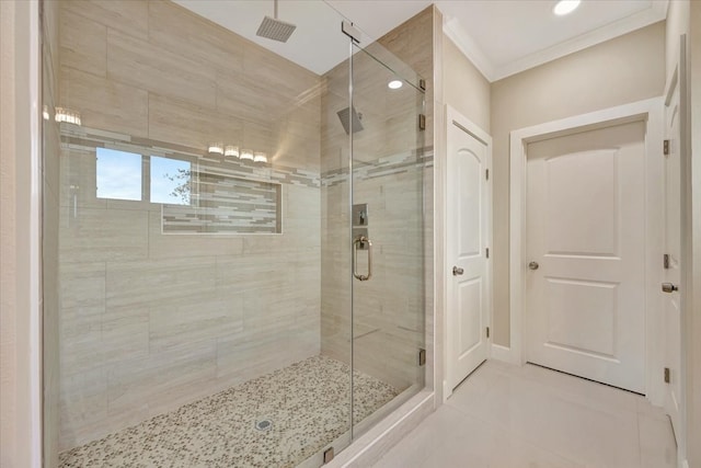 bathroom featuring tile patterned flooring, an enclosed shower, and crown molding