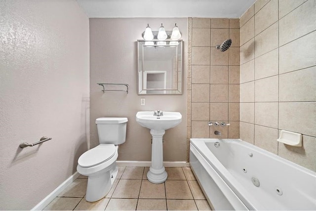 bathroom with tile patterned flooring, a washtub, and toilet