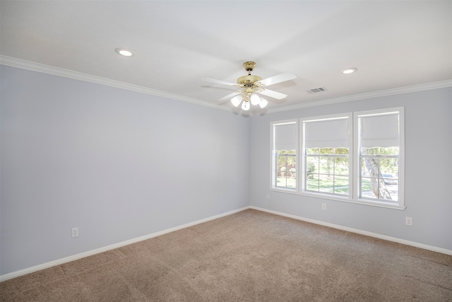 empty room featuring ornamental molding, light carpet, and ceiling fan