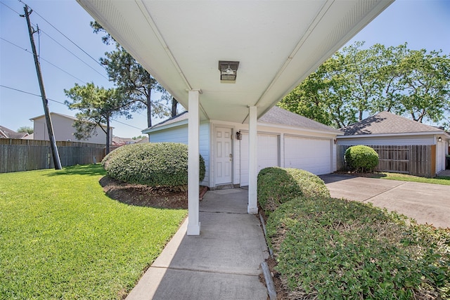 view of front of property with a garage and a front yard