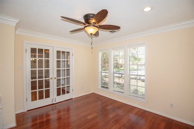 spare room featuring french doors, crown molding, and dark wood-type flooring