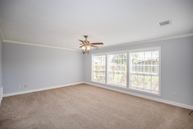 unfurnished room featuring light carpet, ceiling fan, and ornamental molding