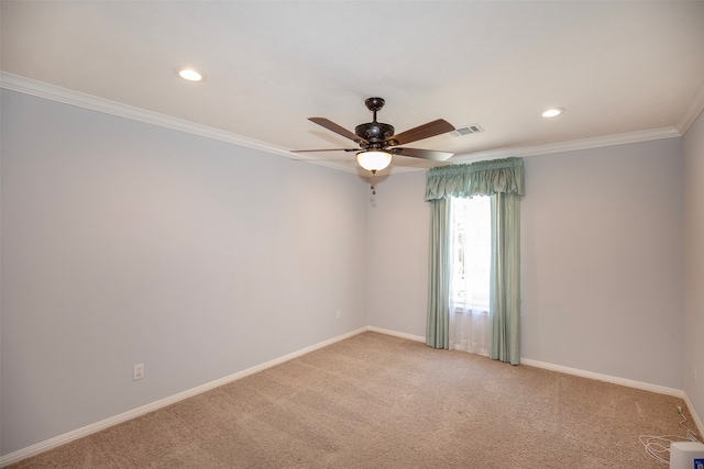 carpeted empty room featuring ornamental molding and ceiling fan