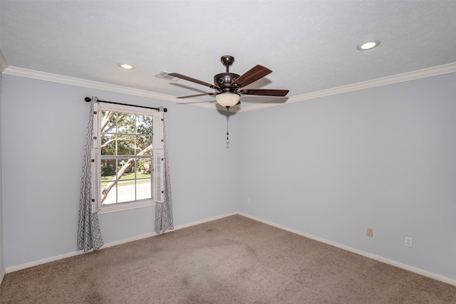 spare room with ornamental molding, carpet flooring, ceiling fan, and a textured ceiling