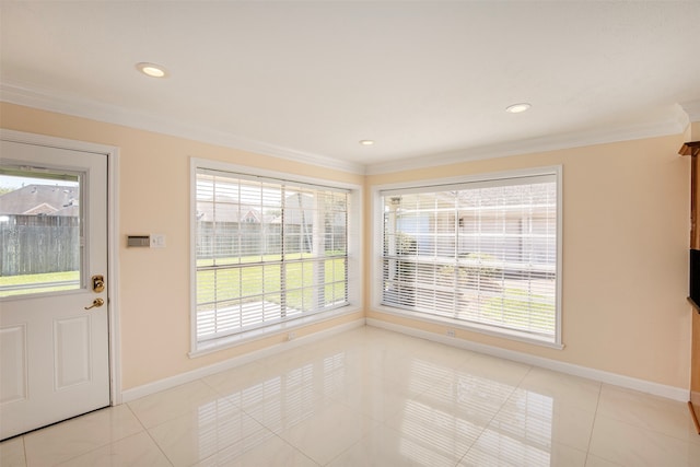 tiled empty room with plenty of natural light and crown molding