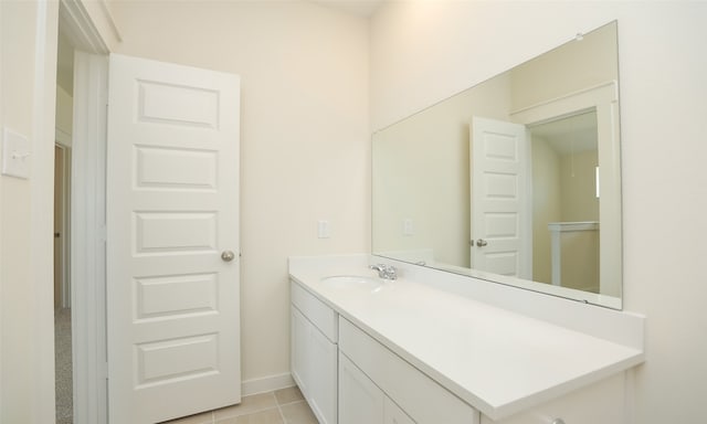 bathroom with tile patterned floors and vanity